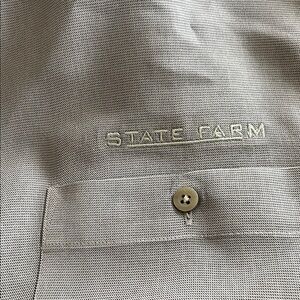 State Farm logo wear. This is Gear For Sports Men's Black and Gray Polo Shirt.